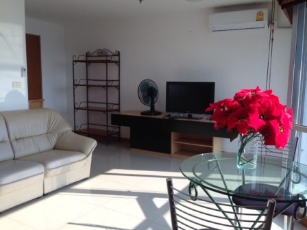 Living area with TV, air-con and dining area